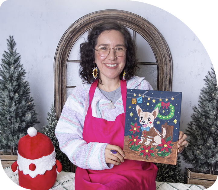 Artist holding a completed custom pet portrait created with the Paint Your Pet kit